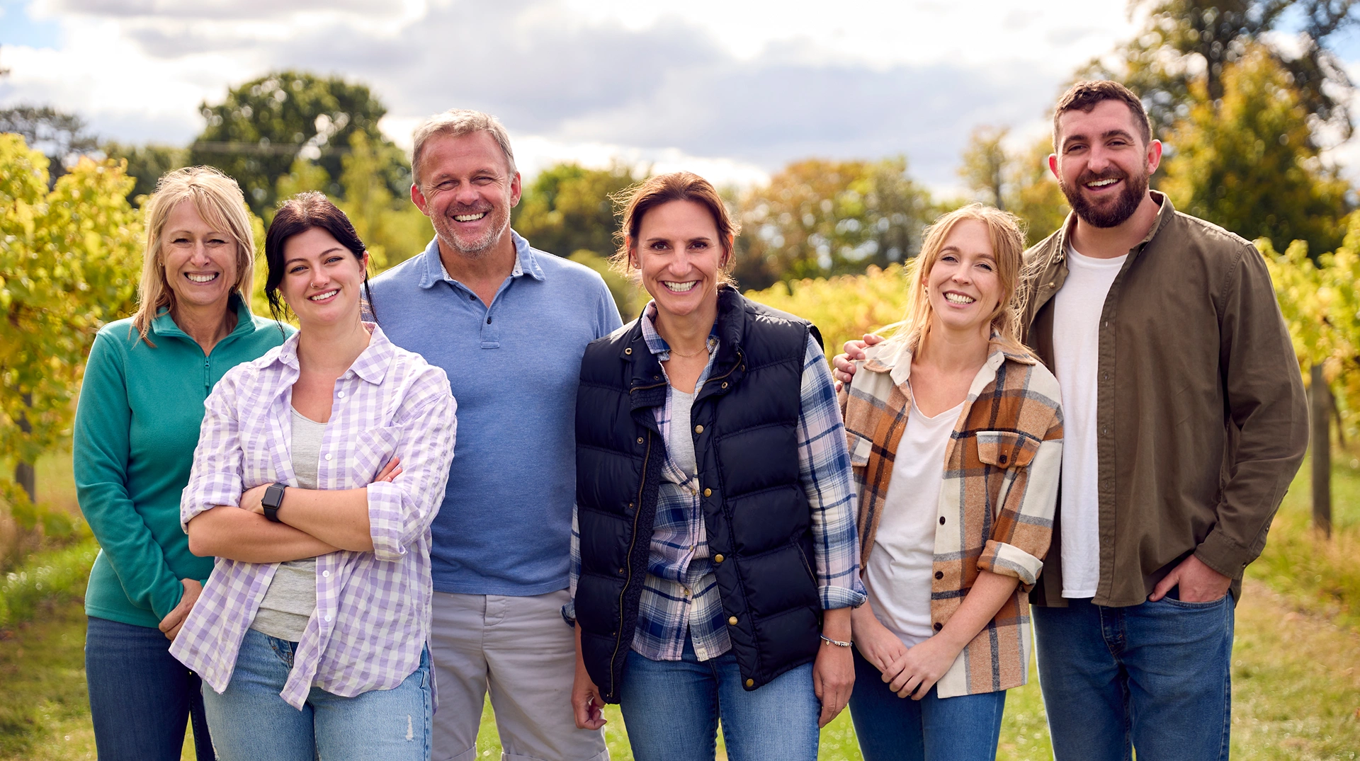 Family smiling together outdoors at Valley Family Dentistry.
